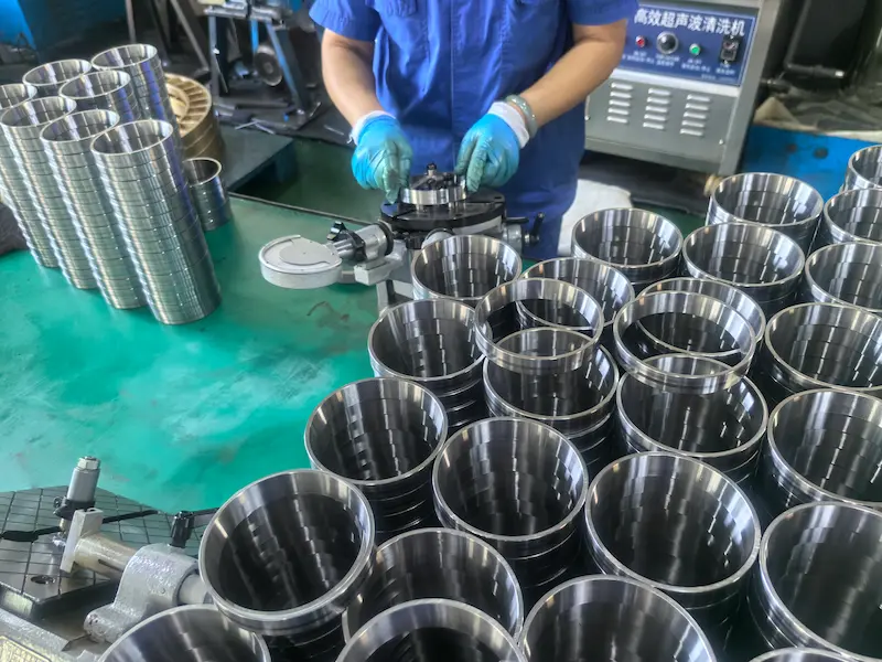 Dust-free cleanroom assembly and precision greasing of angular contact spindle bearings