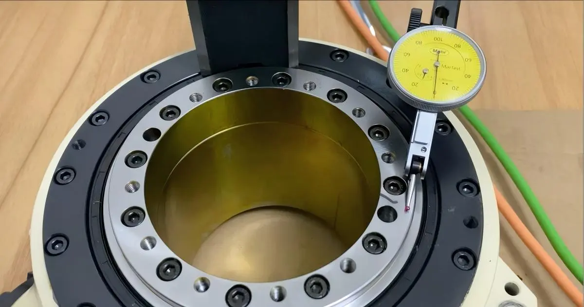 Dial indicator positions for measuring axial and radial runout on a rotary table