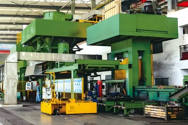 Industrial screw press for metal forming